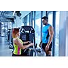Gym woman exercising with her personal trainer