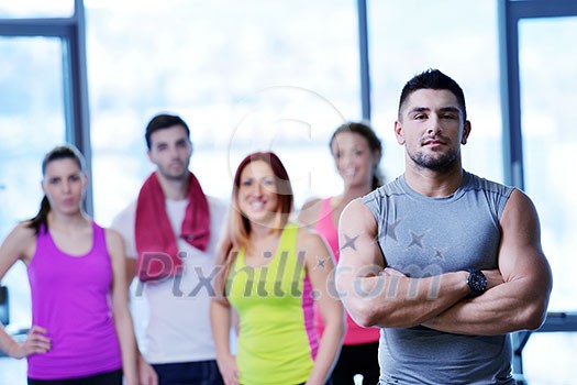 Group of people exercising at the gym and stretching Group of people exercising at the gym and stretching