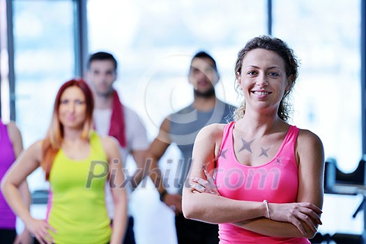 Group of people exercising at the gym and stretching Group of people exercising at the gym and stretching