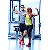 attractive couple at the gym looking happy