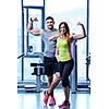 attractive couple at the gym looking happy