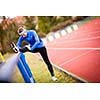 Young woman stretching before her run