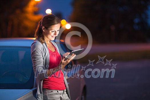 Pretty, female driver using her tablet computer (shallow DOF; color toned image) Pretty, female driver using her tablet computer (shallow DOF; color toned image)