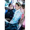 College students sitting in a classroom during class (shallow DOF; color toned image)