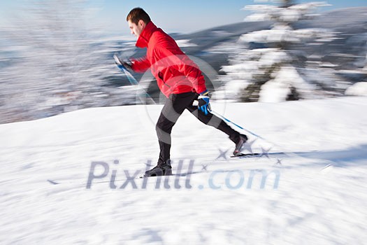 Cross-country skiing: young man cross-country skiing on a lovely sunny winter day Cross-country skiing: young man cross-country skiing on a lovely sunny winter day