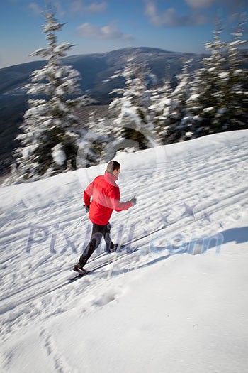 Cross-country skiing: young man cross-country skiing on a lovely sunny winter day Cross-country skiing: young man cross-country skiing on a lovely sunny winter day