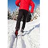 Cross-country skiing: young man cross-country skiing on a lovely sunny winter day