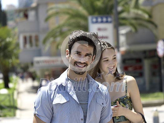 Young couple in love, hugging on the street. Young couple in love, hugging on the street.