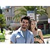 Young couple in love, hugging on the street.