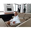 Portrait of senior man relaxing in sofa at home