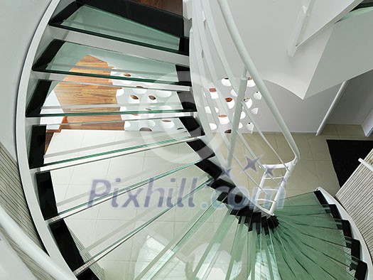 modern glass spiral staircase with metallic hand-rails. modern glass spiral staircase with metallic hand-rails.