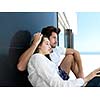 cheerful happy young couple making selfie together at home