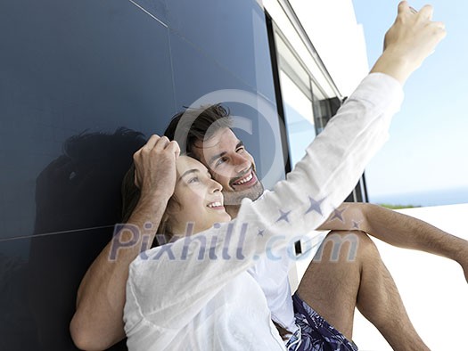 cheerful happy young couple making selfie together at home cheerful happy young couple making selfie together at home