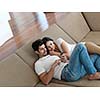 cheerful happy young couple making selfie together at home