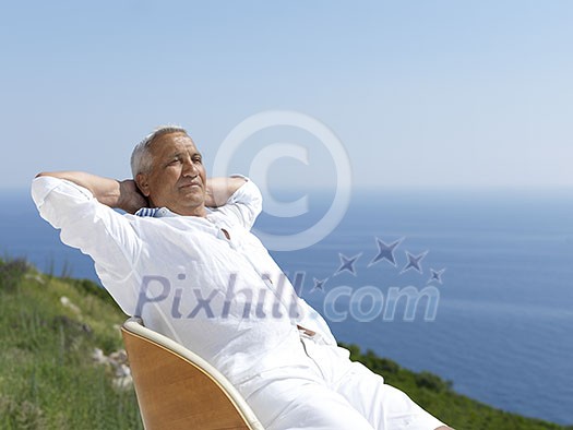 Portrait of senior man sitting outside Portrait of senior man sitting outside
