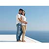 happy young romantic couple have fun relax smile at modern home outdoor terace balcony terace