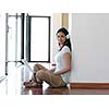beautiful young woman relax and work on laptop computer modern  home office while listening musin on white headphones