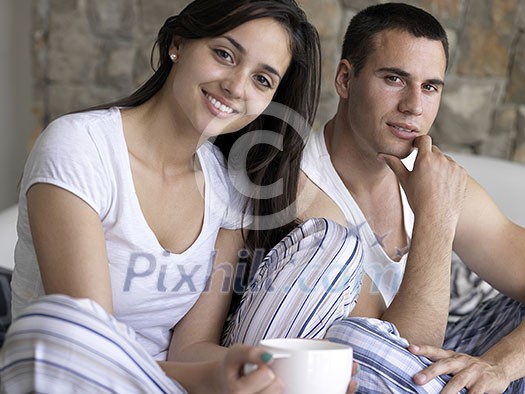happy young couple relax and have fun in bed happy young couple relax and have fun in bed