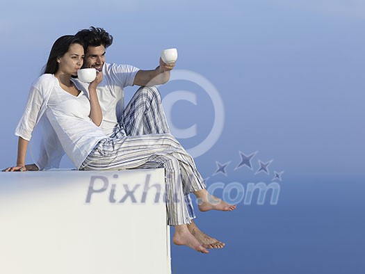 happy young romantic couple have fun relax smile at modern home outdoor terace balcony terace happy young romantic couple have fun relax smile at modern home outdoor terace balcony terace
