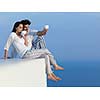 happy young romantic couple have fun relax smile at modern home outdoor terace balcony terace