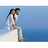 happy young romantic couple have fun relax smile at modern home outdoor terace balcony terace