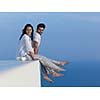 happy young romantic couple have fun relax smile at modern home outdoor terace balcony terace