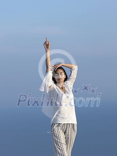 happy young woman enjoy sunset while dancing and enjoy music on headphones happy young woman enjoy sunset while dancing and enjoy music on headphones
