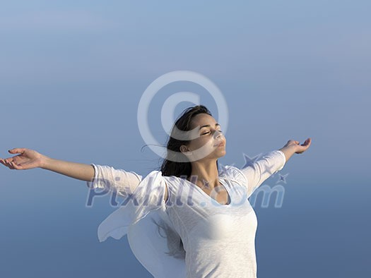 happy young woman enjoy sunset while dancing and enjoy music on headphones happy young woman enjoy sunset while dancing and enjoy music on headphones