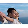 happy young romantic couple have fun relax smile at modern home outdoor terace balcony terace