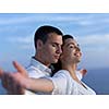 happy young romantic couple have fun relax smile at modern home outdoor terace balcony terace