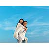 happy young romantic couple have fun relax smile at modern home outdoor terace balcony terace