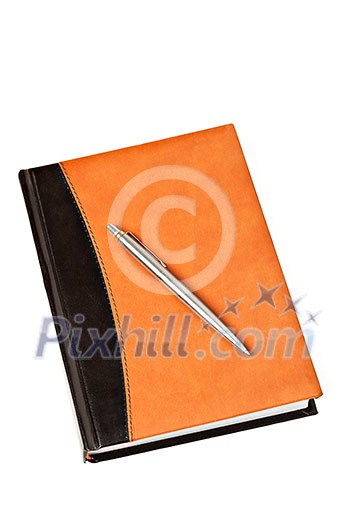 Diary with leather cover and metal pen on table isolated on white background Diary with leather cover and metal pen on table isolated on white background