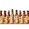 Wooden chess pieces on chessboard. Selective focus, shallow depth of field