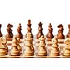 Wooden chess pieces on chessboard. Selective focus, shallow depth of field