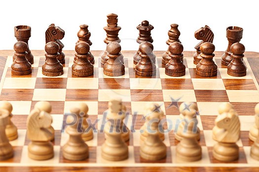 Wooden chess pieces on chessboard. Selective focus, shallow depth of field Wooden chess pieces on chessboard. Selective focus, shallow depth of field