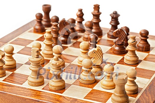 Wooden chess pieces on chessboard. Selective focus, shallow depth of field Wooden chess pieces on chessboard. Selective focus, shallow depth of field