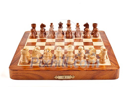Wooden chess on chessboard ready to play Wooden chess on chessboard ready to play
