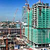 Building house constraction site with cranes. Square format