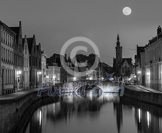 European medieval night city view background - Bruges Brugge canal in the evening, Belgium. Black and white version European medieval night city view background - Bruges Brugge canal in the evening, Belgium. Black and white version