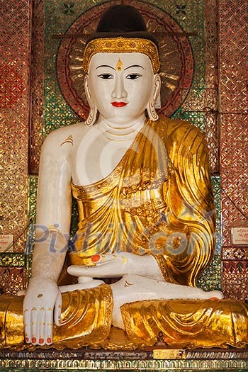 Buddha statue in Burma famous sacred place and tourist attraction landmark - Shwedagon Paya pagoda. Yangon, Myanmar Buddha statue in Burma famous sacred place and tourist attraction landmark - Shwedagon Paya pagoda. Yangon, Myanmar