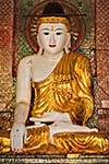 Buddha statue in Burma famous sacred place and tourist attraction landmark - Shwedagon Paya pagoda. Yangon, Myanmar
