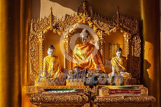 Buddha statues in Burma famous sacred place and tourist attraction landmark - Shwedagon Paya pagoda. Yangon, Myanmar Buddha statues in Burma famous sacred place and tourist attraction landmark - Shwedagon Paya pagoda. Yangon, Myanmar