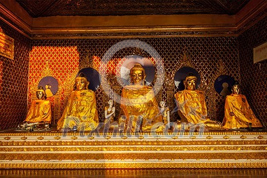 Buddha statues in Burma famous sacred place and tourist attraction landmark - Shwedagon Paya pagoda. Yangon, Myanmar Buddha statues in Burma famous sacred place and tourist attraction landmark - Shwedagon Paya pagoda. Yangon, Myanmar