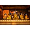 Buddha statues in Burma famous sacred place and tourist attraction landmark - Shwedagon Paya pagoda. Yangon, Myanmar