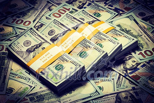 Creative business finance making money concept. Vintage retro effect filtered hipster style image of background of of new 100 US dollars 2013 edition banknotes bills bundles close up Creative business finance making money concept. Vintage retro effect filtered hipster style image of background of of new 100 US dollars 2013 edition banknotes bills bundles close up