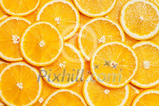 Colorful orange citrus fruit slices background top view Colorful orange citrus fruit slices background top view