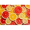 Colorful citrus fruit - lemon, orange, grapefruit - slices background