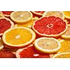 Colorful citrus fruit - lemon, orange, grapefruit - slices background