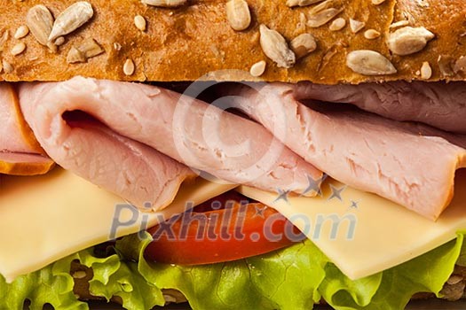 Ham sandwich with lettuce, cheese, tomato close up Ham sandwich with lettuce, cheese, tomato close up