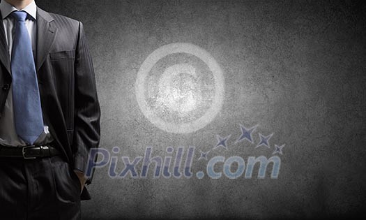 Chest view of businessman against cement wall Chest view of businessman against cement wall